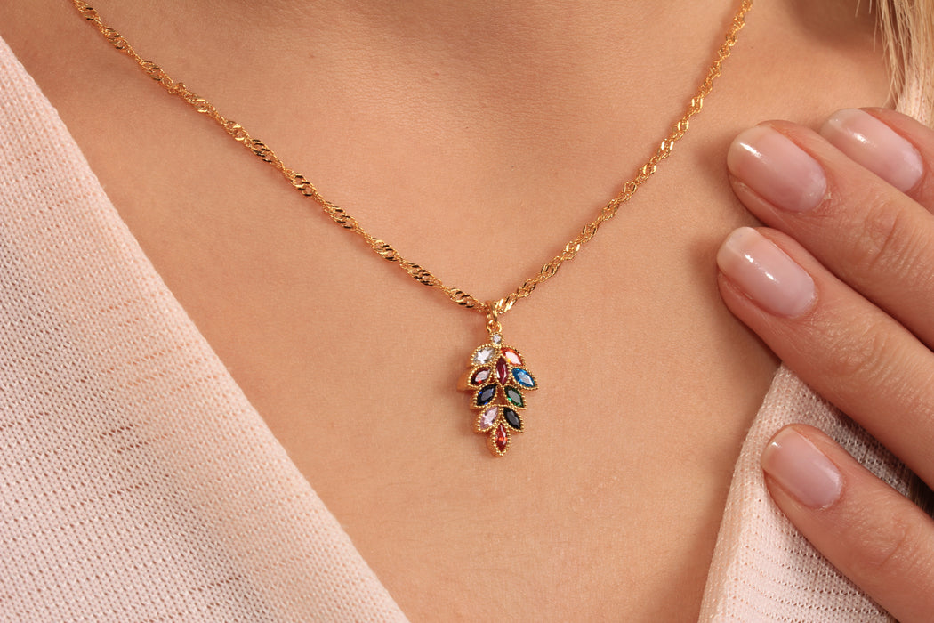 Gold Necklace With Baguette Stone Leaf Charm