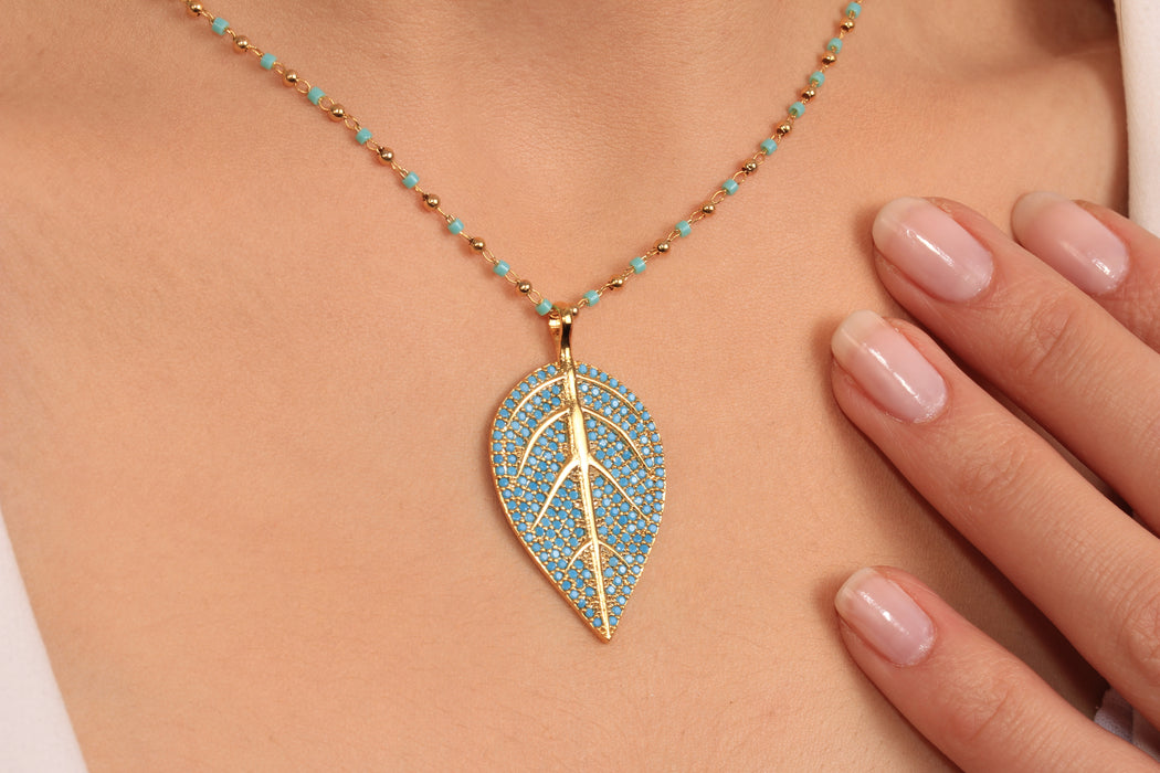 Gold Beaded Necklace With Cubic Zirconia Leaf Pendant