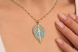 Gold Beaded Necklace With Cubic Zirconia Leaf Pendant